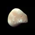 Deimos: Mars' Tiny and Mysterious Moon
