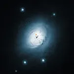 HD 100546 b : Une exoplanète géante en formation dans une zone habitable étendue