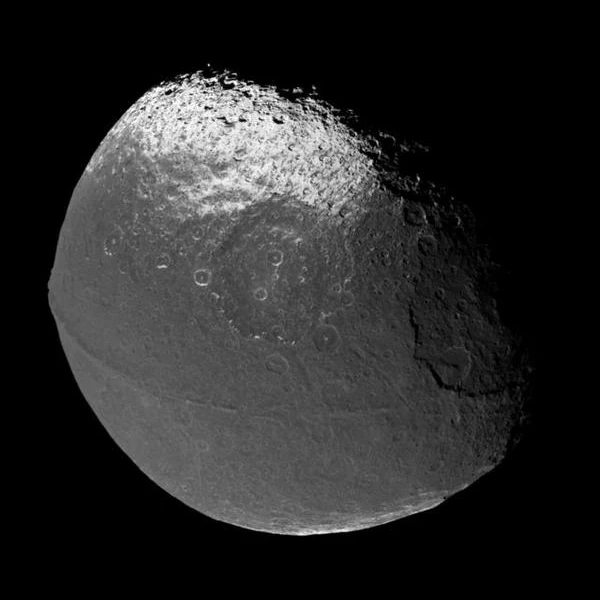 Iapetus as seen by the Cassini probe showing its hemispheric dichotomy and equatorial ridge
