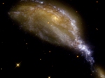 A small galaxy tears apart the large NGC 6745